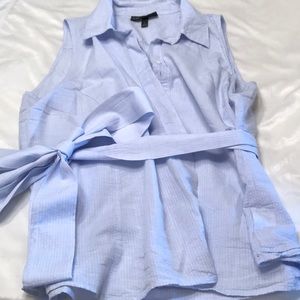 Sleeveless blouse with tie waist